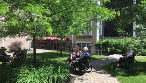 Seniors sitting in the backyard of the CHSLD L.-B.- Desjardins, nursing home in Saint-Sauveur, Québec